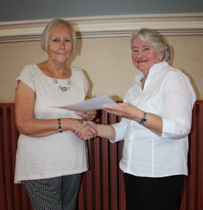 Jan Rickwood receiving her much deserved award from fellow resident Tina Peters